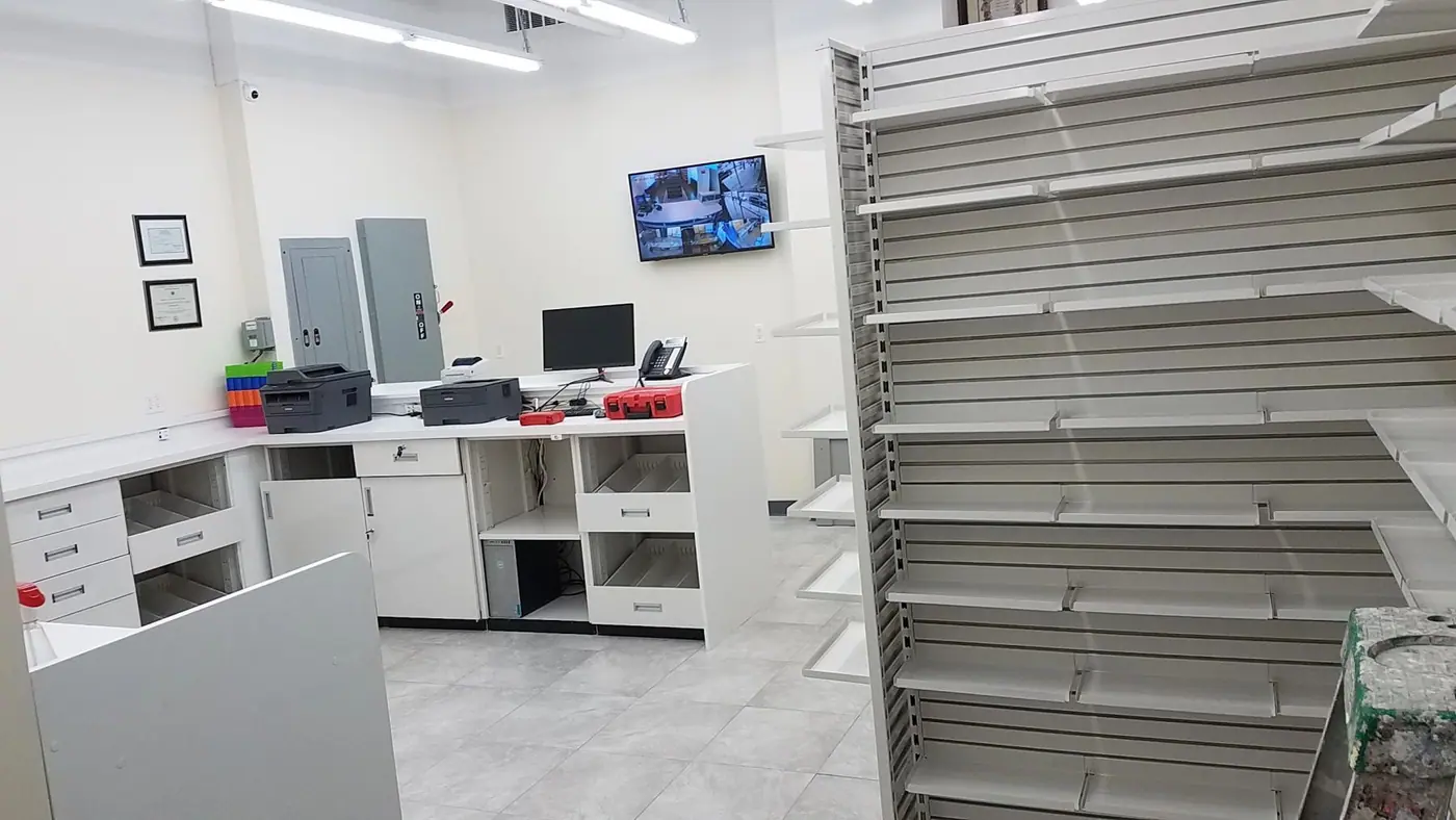 Finished dispensing counter and back shelving in the Downtown Brooklyn pharmacy