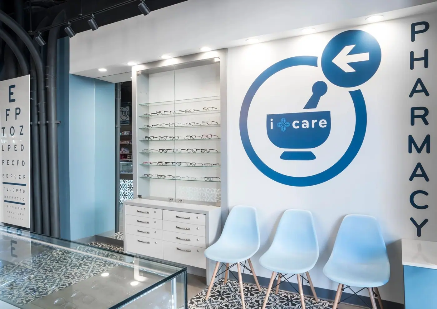 Finished pharmacy and optical counter with an eyewear wall and patterned tile floor in Downtown Brooklyn