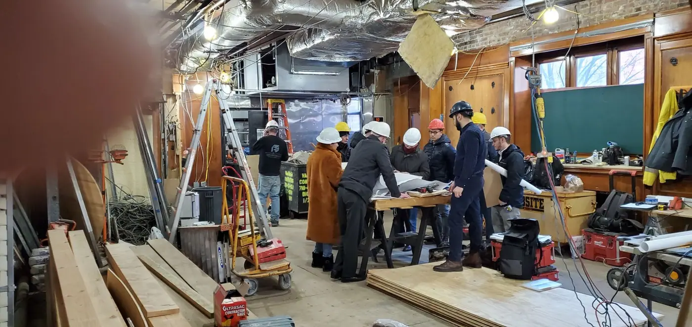 Advanced Builders Group team reviewing drawings on a job site