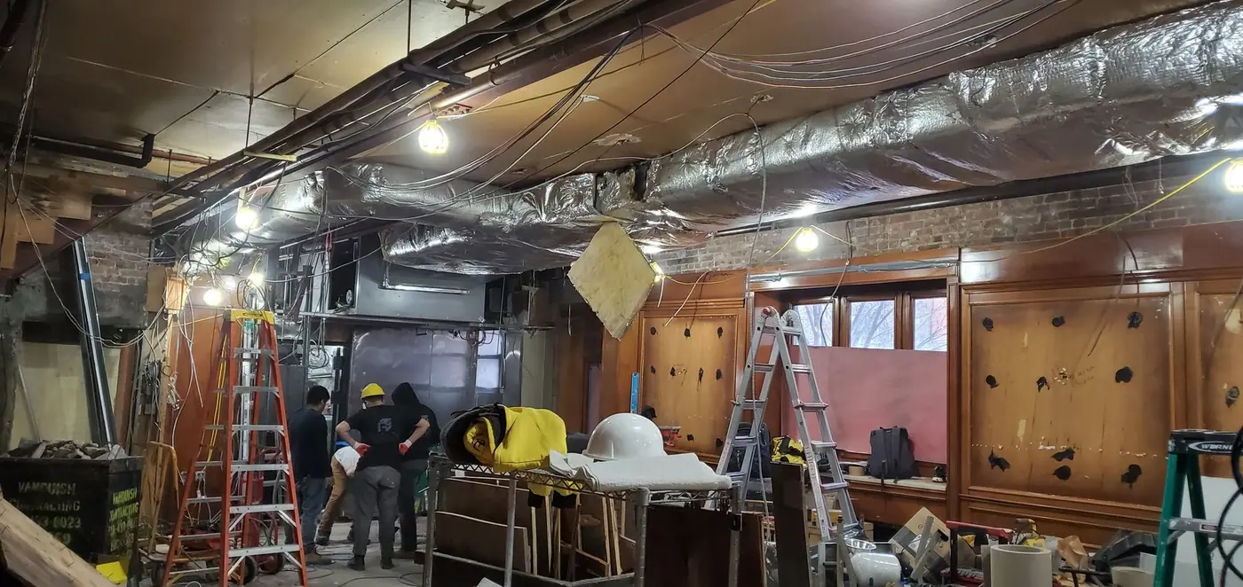 Crew framing new walls inside the Upper East Side restaurant